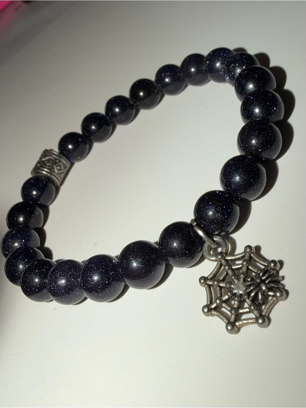 Sparkling black spinel Goldstone Beaded Bracelet with Spiderweb Charm